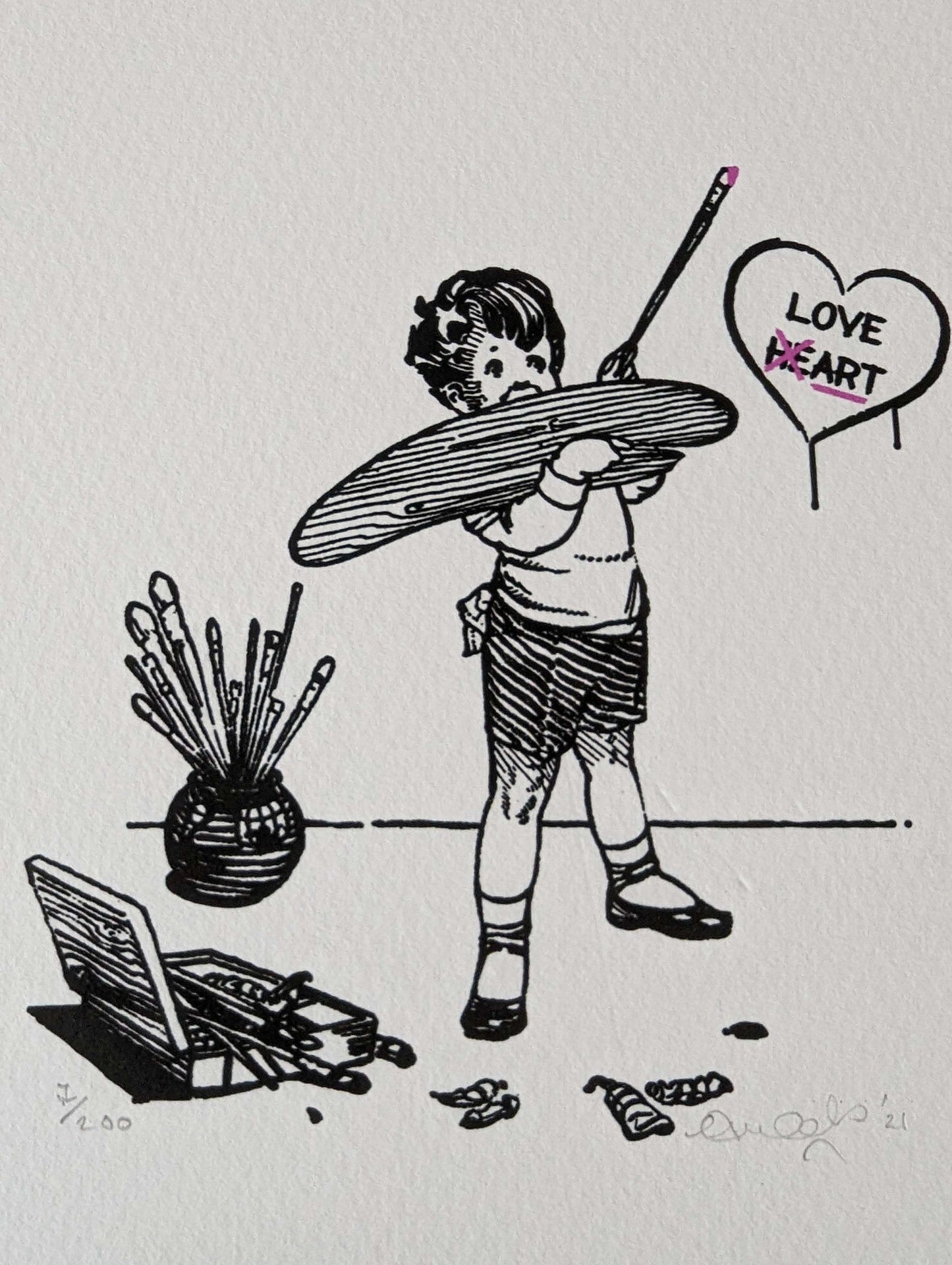 CLOSE UP OF A LITTLE BOYS PAINTING ON THE WALL, PAINT BRUSHES AND OILS EVERYWHERE, PICTURE ON WALL IS A HEART WITH THE WORDS LOVE HEART PAINTED INSIDE, BUT THE HE IS CROSSED OUT TO SAY ART.