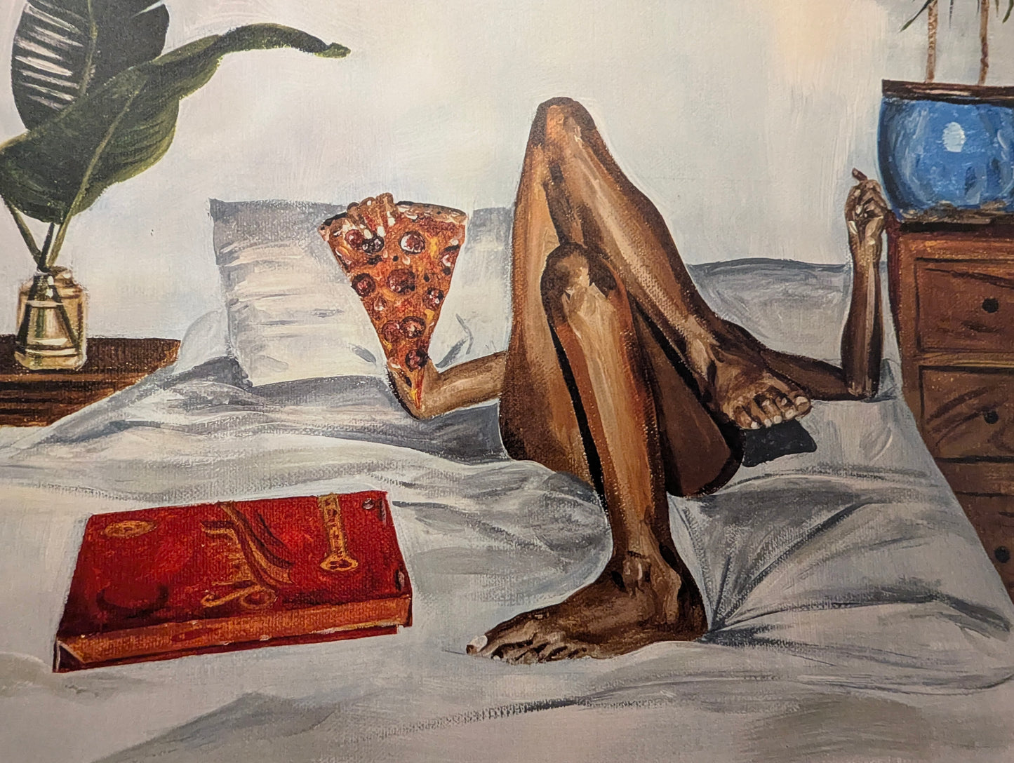 Art print of a person lying on a bed eating a pizza slice next to pizza box with a plant and nightstand.