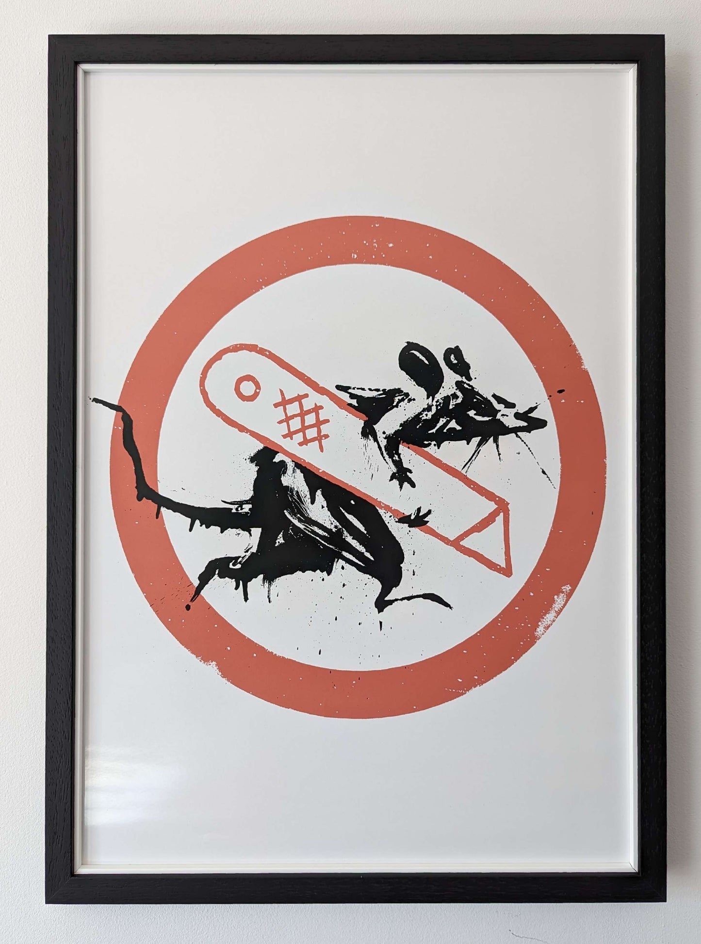 banksy artwork rat holding a stanley knife