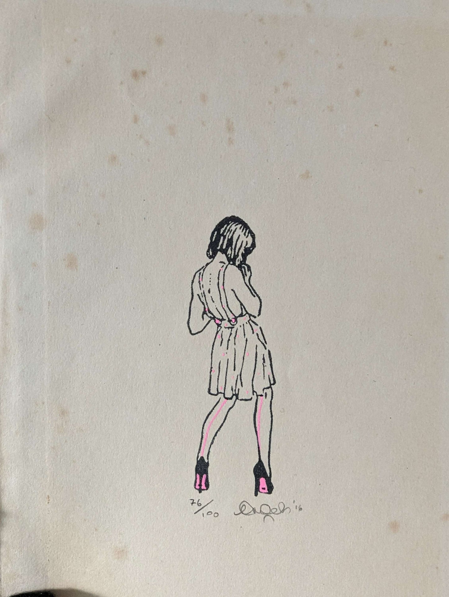 CEAL WARNANTS High Fashion close up of artwork on old book paper, woman with back to us in pencil drawing style with pink details to her summer dress and high heel shoes