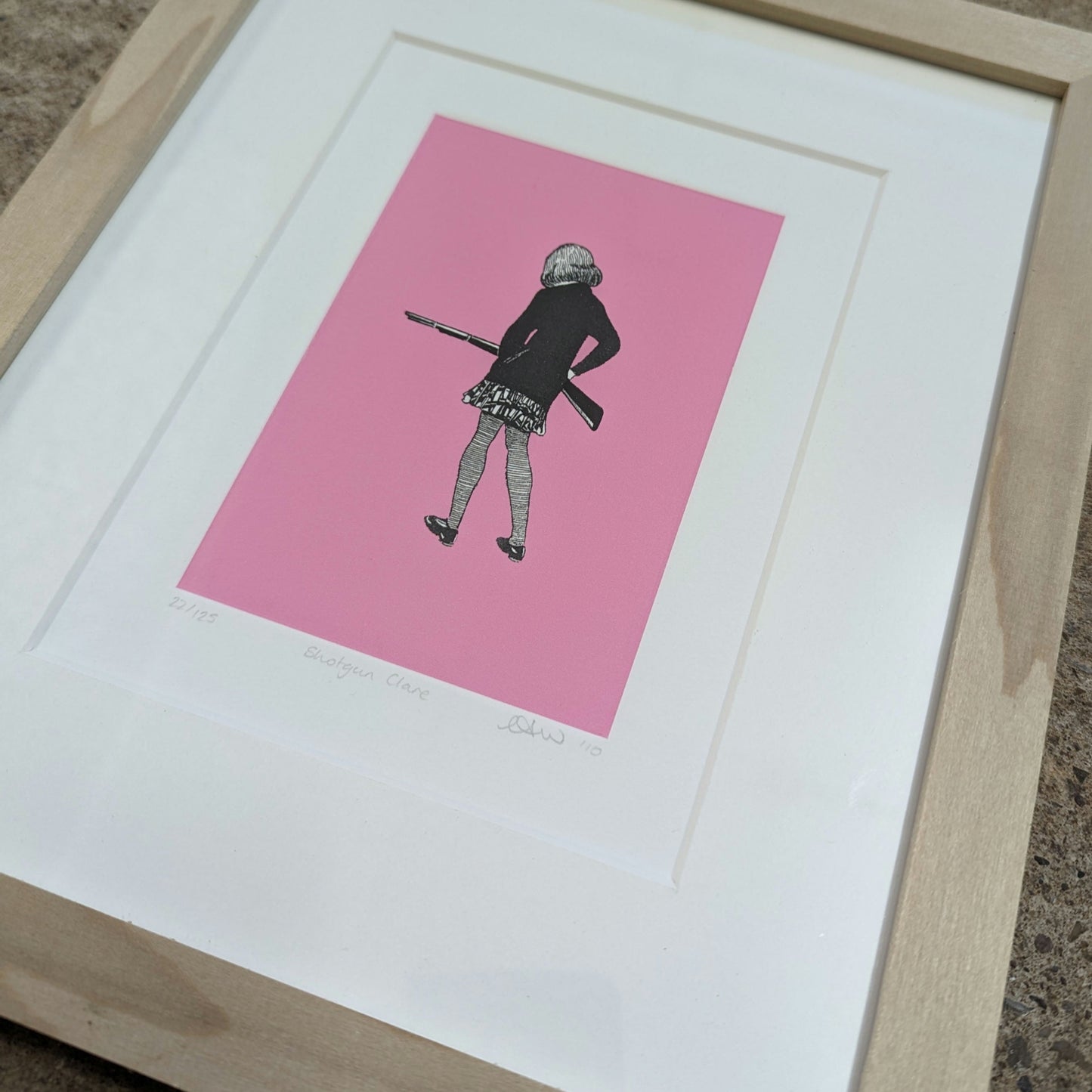 CEAL WARNANTS 'SHOTGUN CLARE' Ltd Ed Print framed in tulip wood with white mountboard, artwork is of a girl with back to us holding a rifle, the styel is 1940s sketch on vivid pink background.