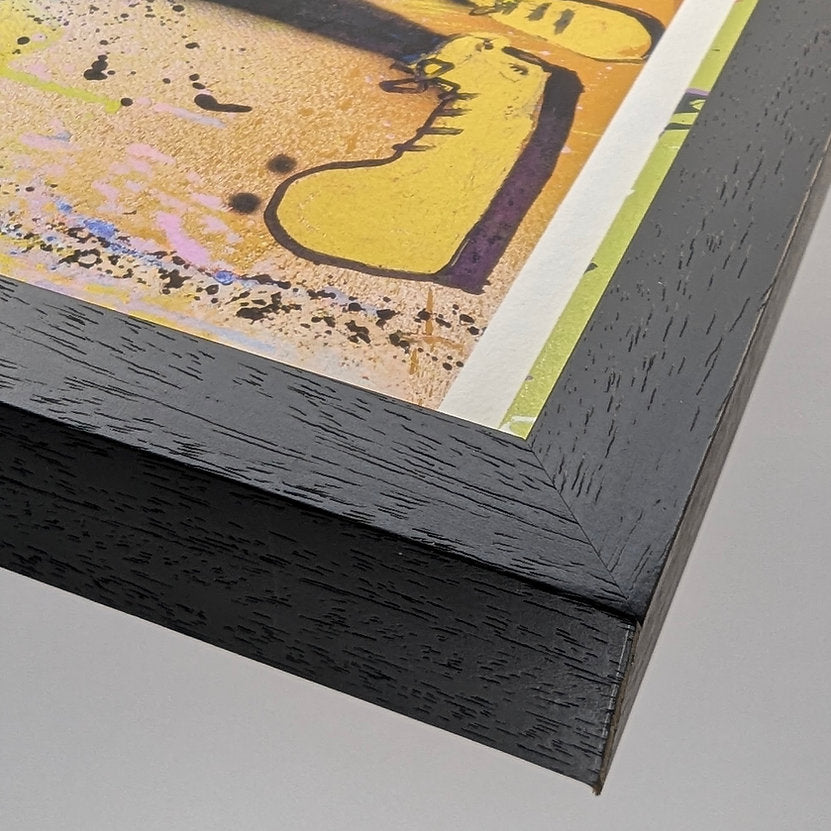 close up of wood moulding, black with a woodgrain finish. against a white background