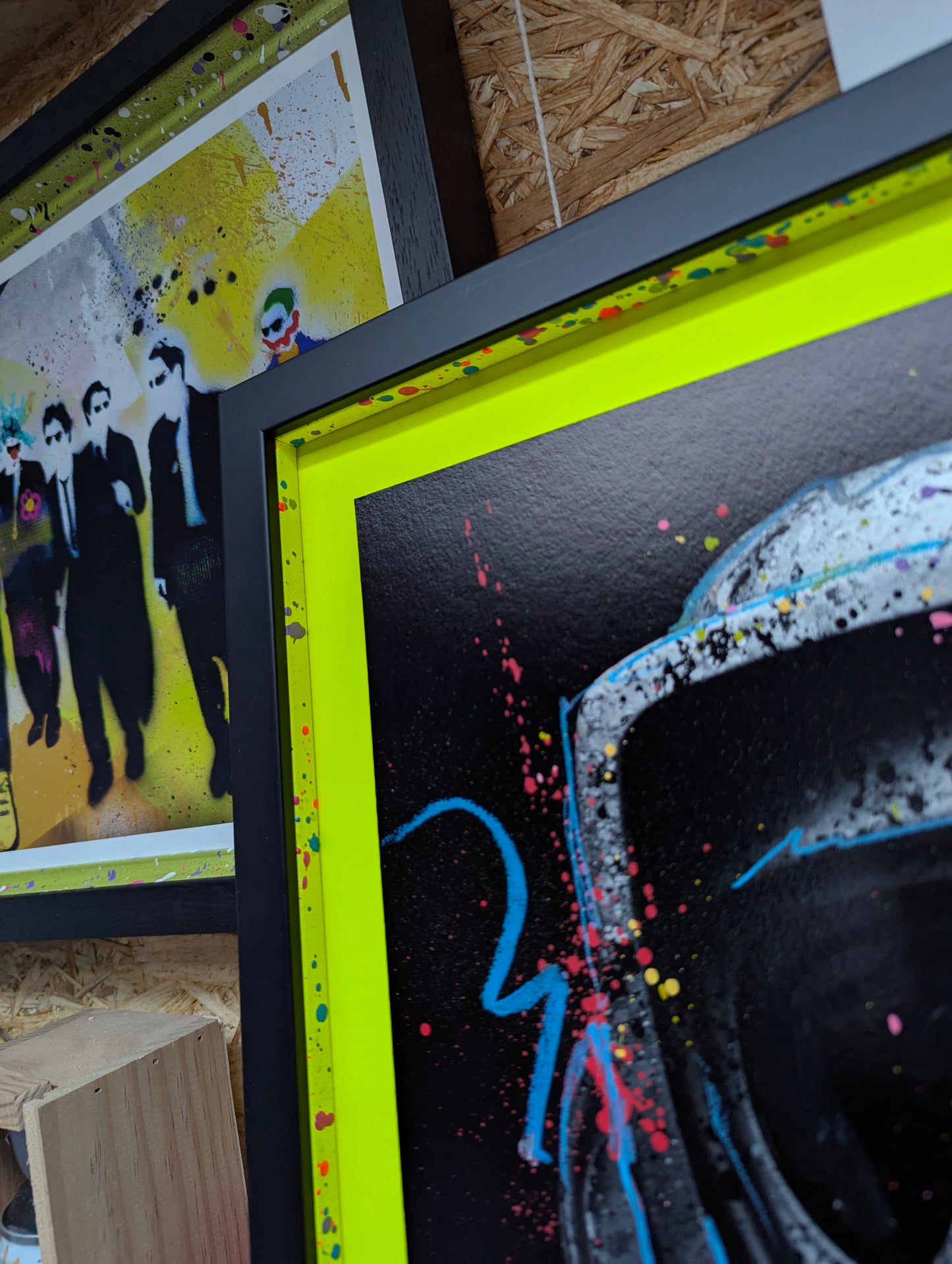 corner of picture frame for LP edits tree hugger, shows close up of the neon backing and the matching colour slips with pink, blue and purple splatter