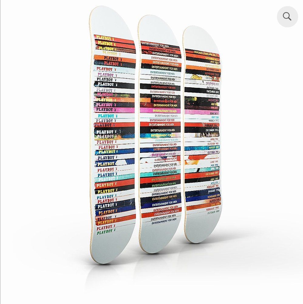 side view of mark vessey skateboards on a white back ground, the skateboards have the playboy covers on them