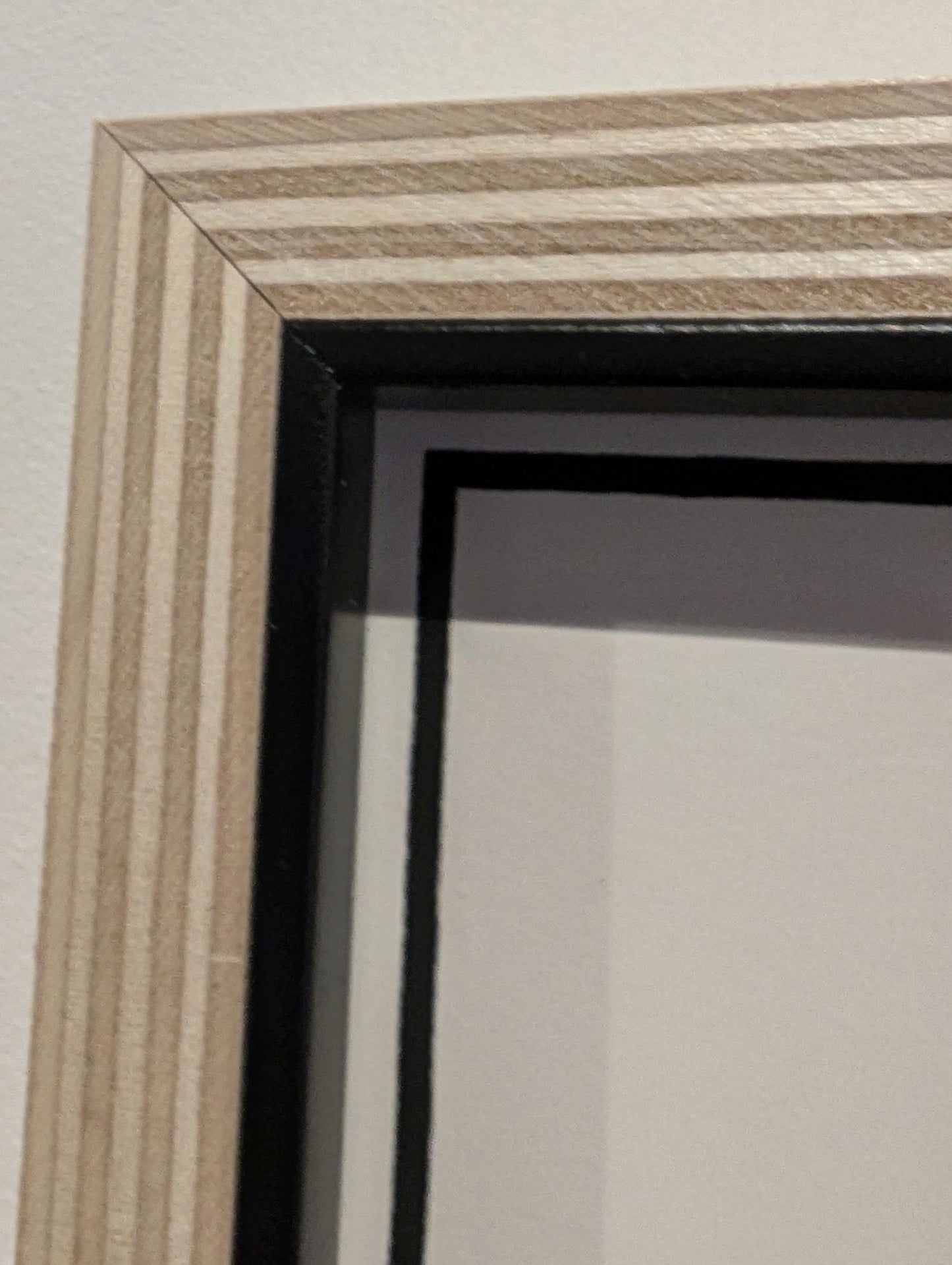 corner of the bespoke, framed in plywood frame with black slip