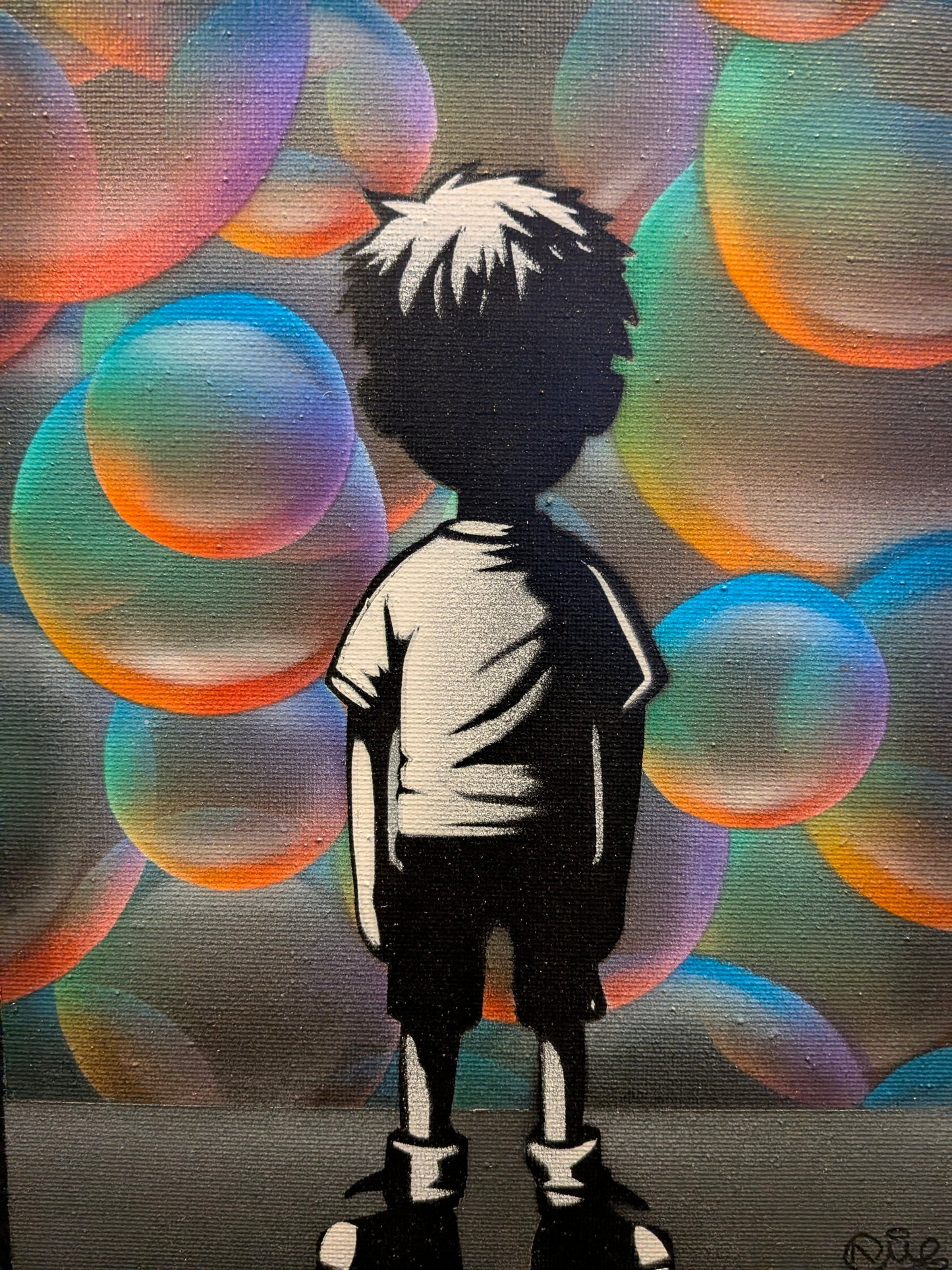 Silhouette of a person against colorful bubbles