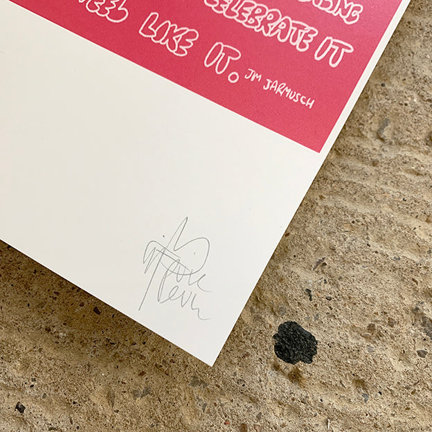 close up of pure evil signature against a concrete background