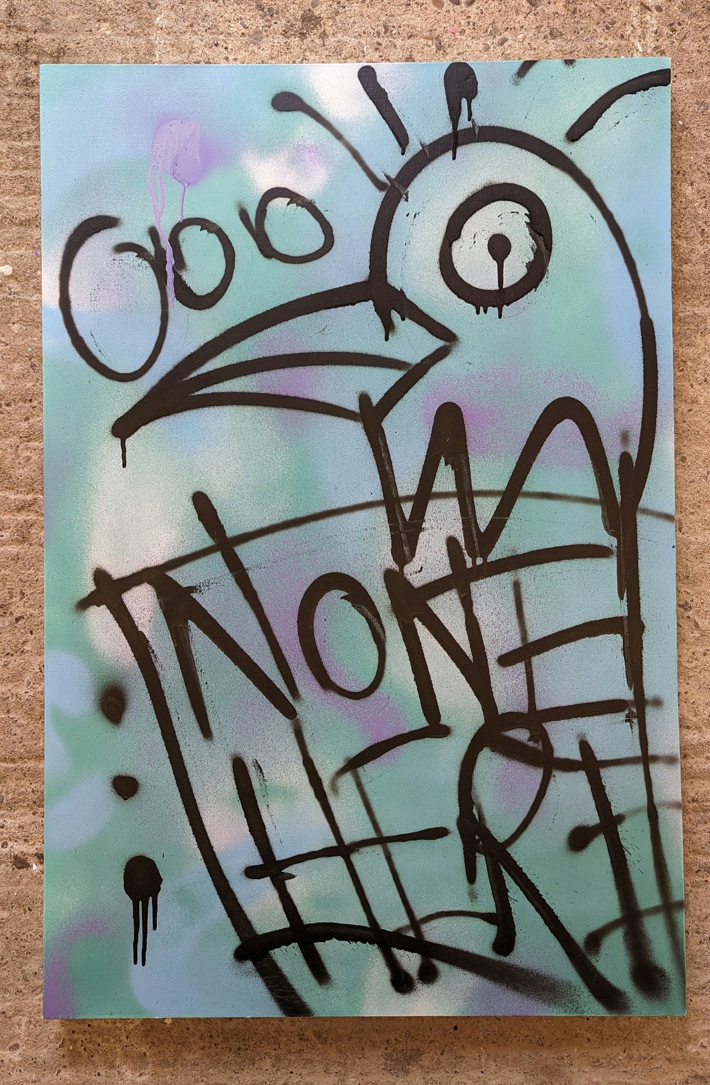 canvas with purple and teal background. doodle bird with none here tag, canvas is against a concrete background.