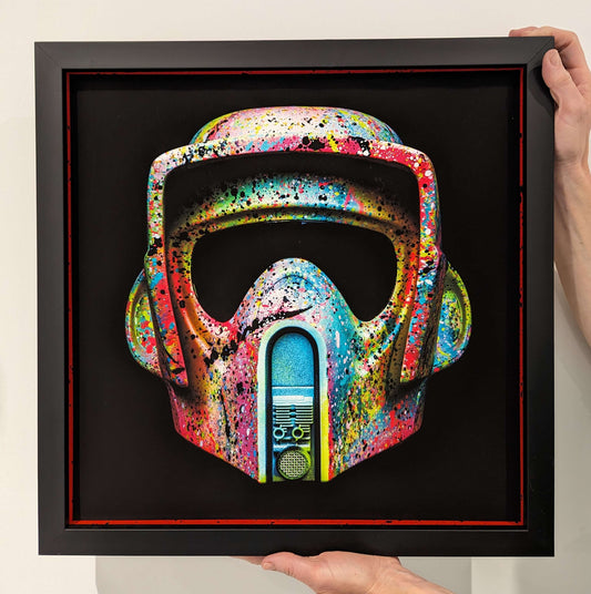 LP edits starwars mask with graffiti style finish in black frame being held in corners in front of white background