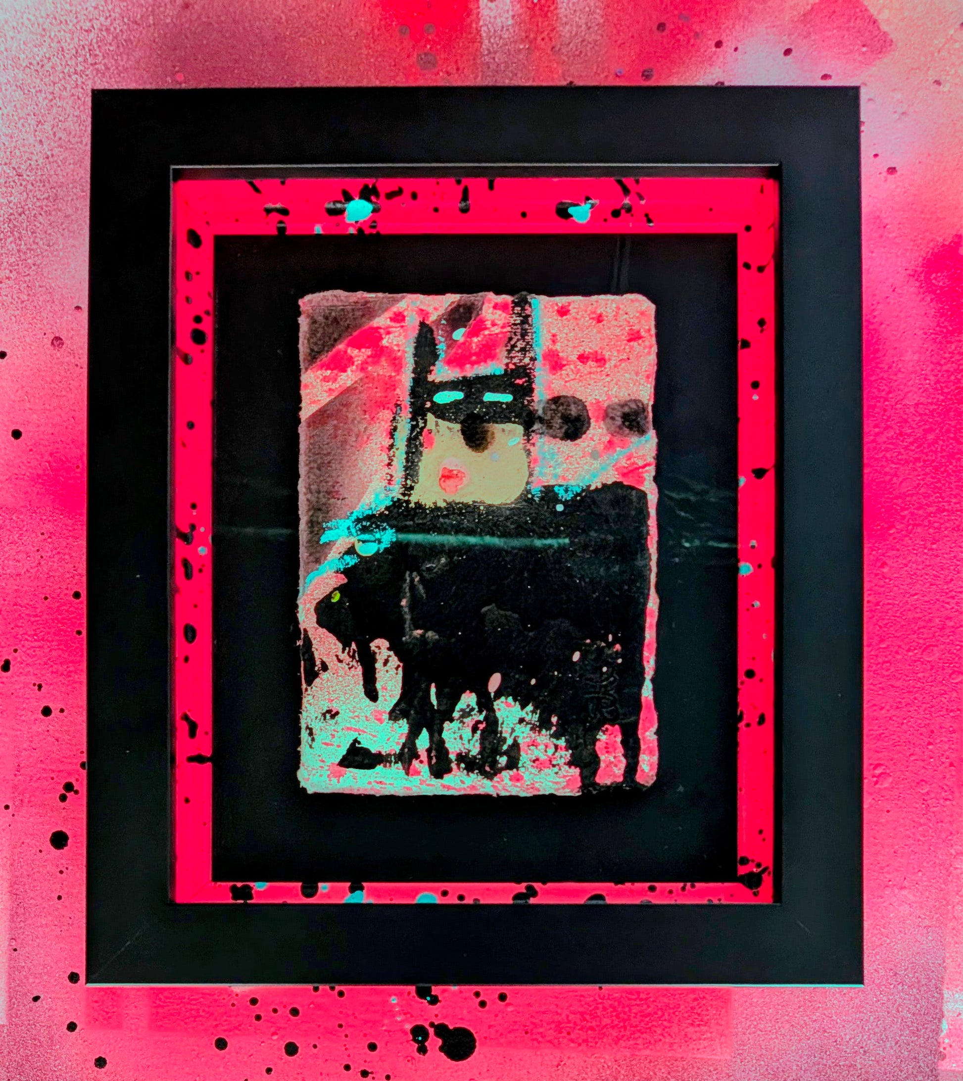 Framed abstract artwork with a pink border on a pink background
