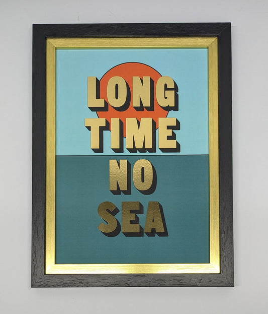 Gold writing long time no sea in black gold frame against a white background 