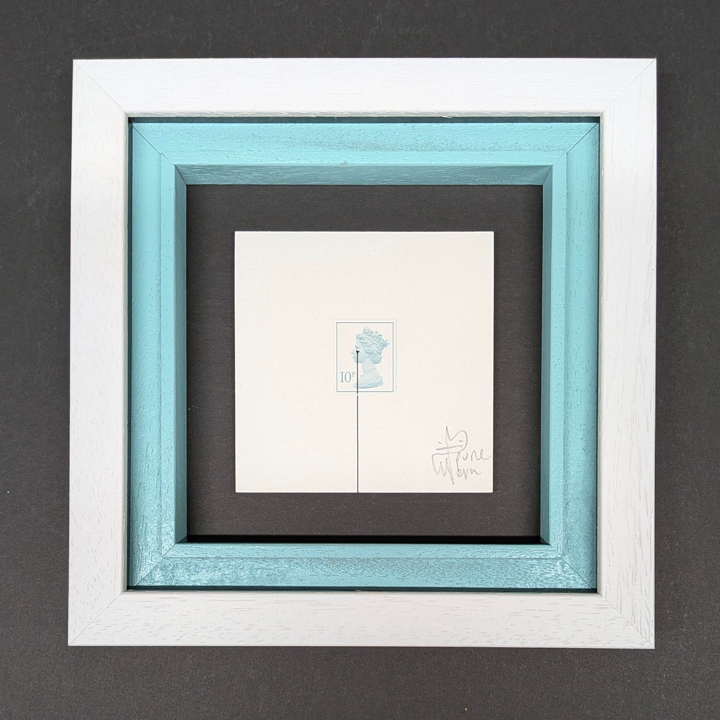 Framed pure evil queen stamp artwork with a white border and black mat on a gray background