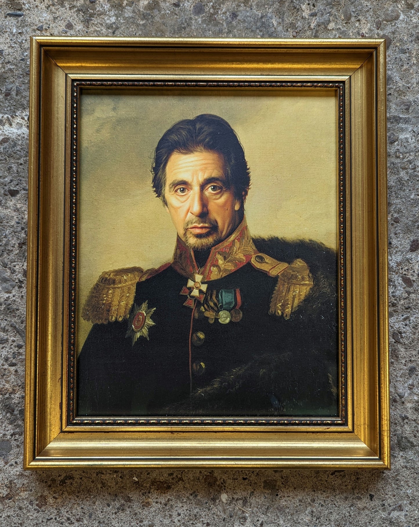 Al pacino in old war costume, framed in an ornate gold frame