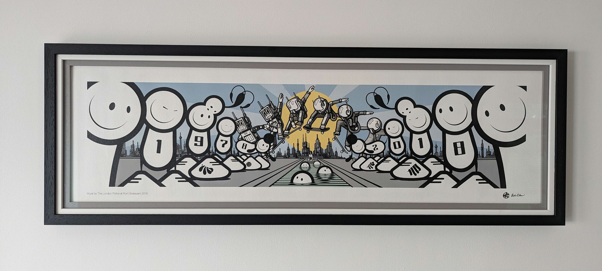 London police white cartoon spray characters lined up in front of a city landscape with a large sun shining while a robot character ollies in front of the sun. artwork is framed in a triple frame, outside frame is black, middle white and inside is grey.