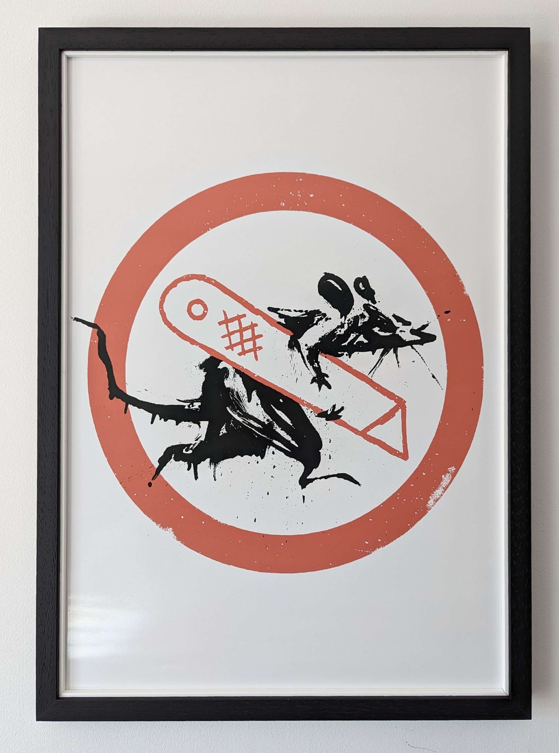 banksy artwork rat holding a stanley knife