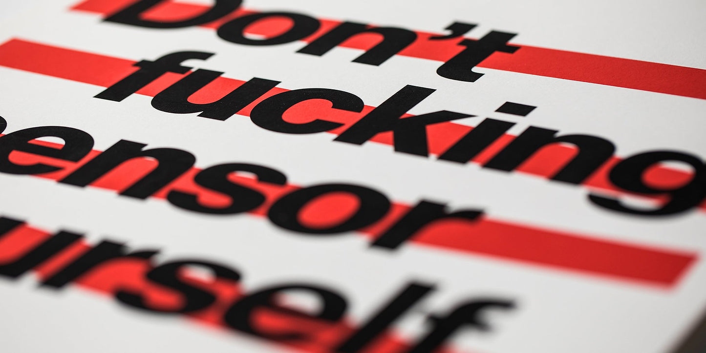 good fucking design advice don't censor yourself, close up of text. artwork is on white paper, text is black with red lines behind it
