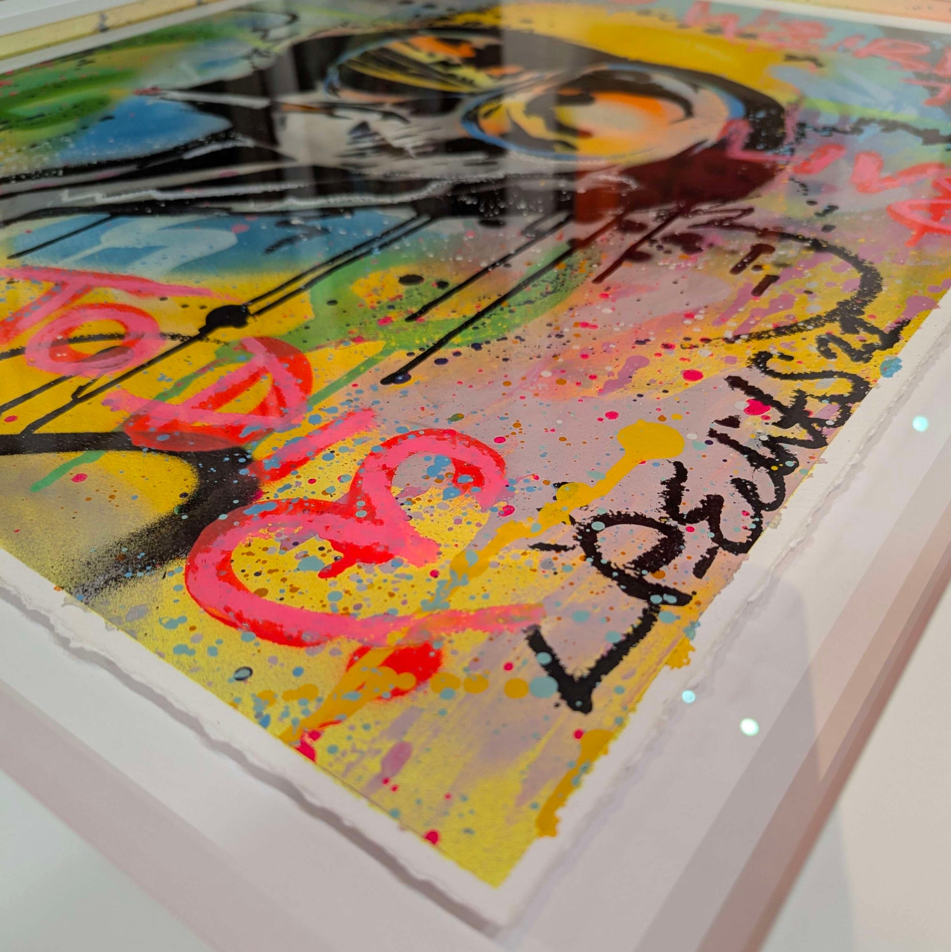Lp edits fear and loathing film remixed in LP edits style lots of paint splatter with yellow green and blue graffiti fades in a white frame, corner of frame 