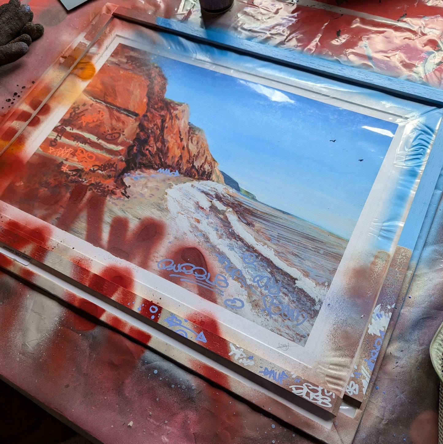 artwork is on a bench, the slips are also next to artwork which shows how thye were panted to colour match