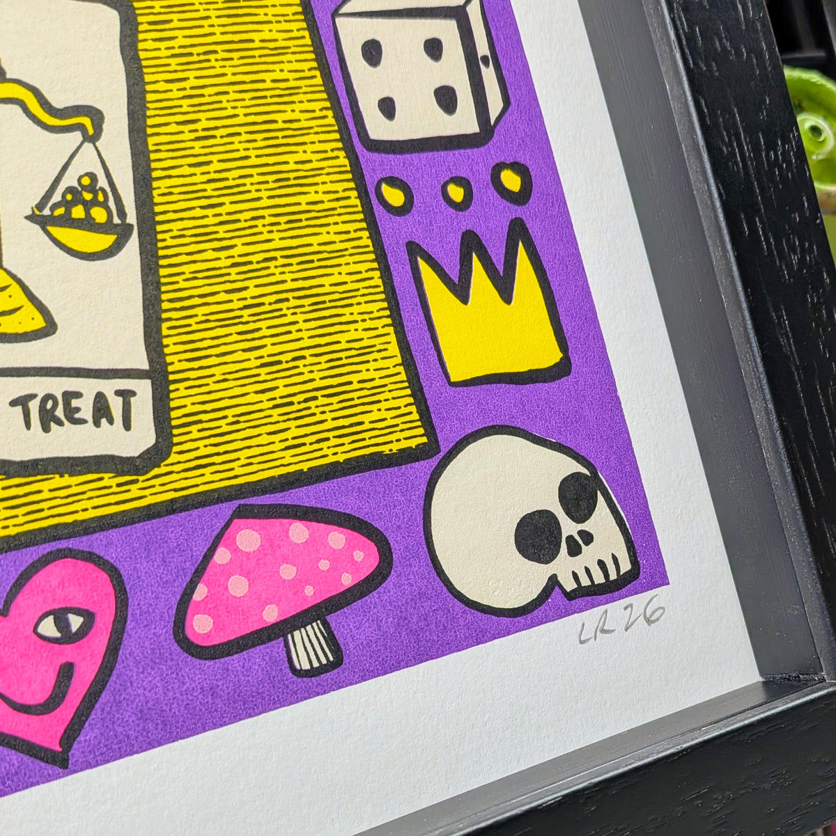 skulls, crowns and dice artwork in black wood grain frame
