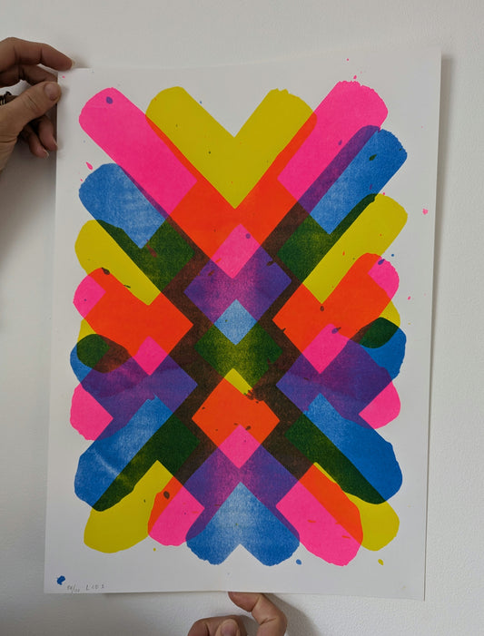 Colorful geometric pattern on a white background, two hands holding