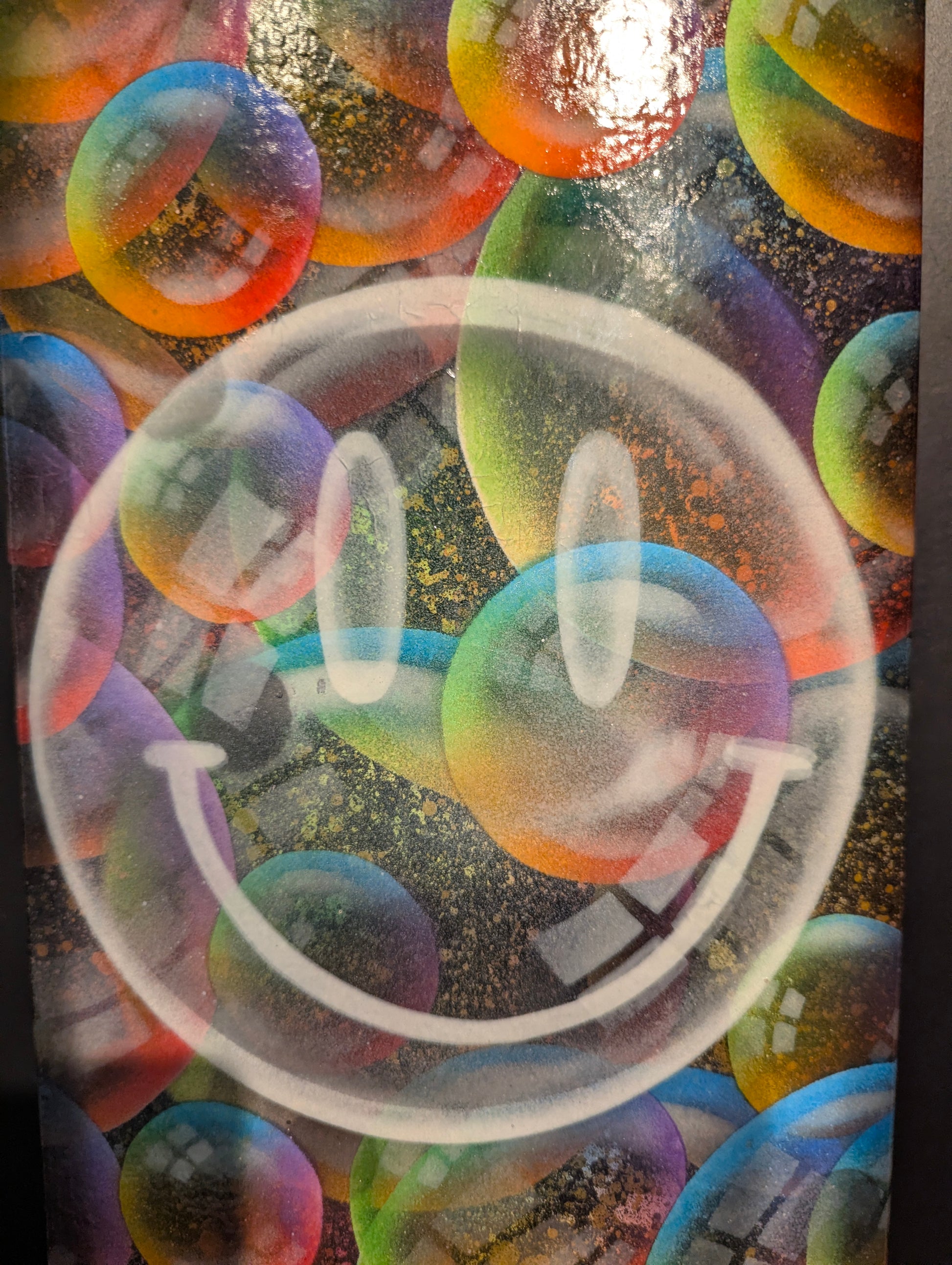 Colorful bubble wrap with multicolored bubbles on a textured surface