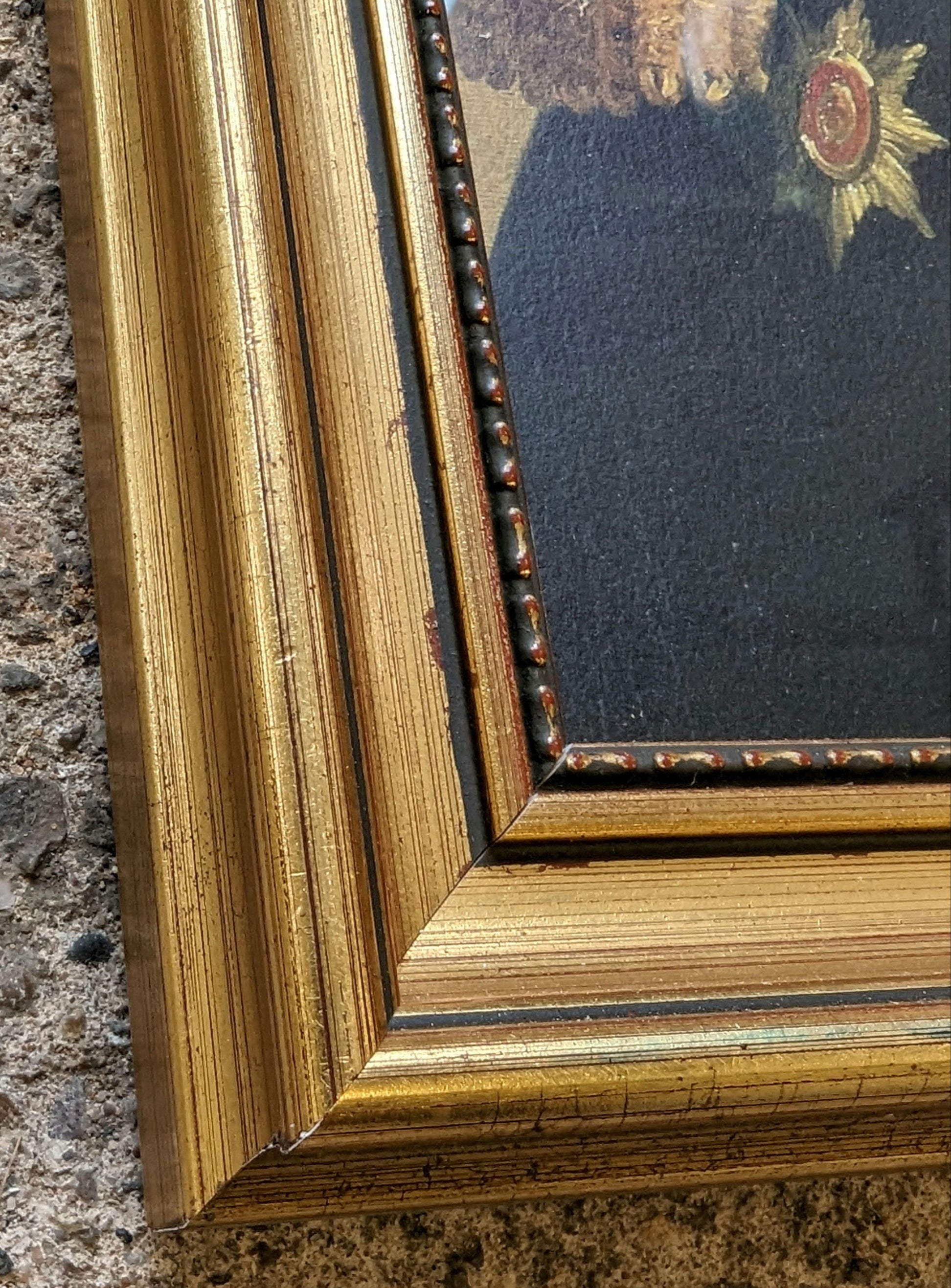 close of corner of gold frame