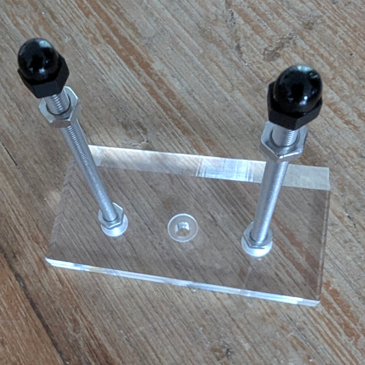 clear bracket for skateboard on wood background