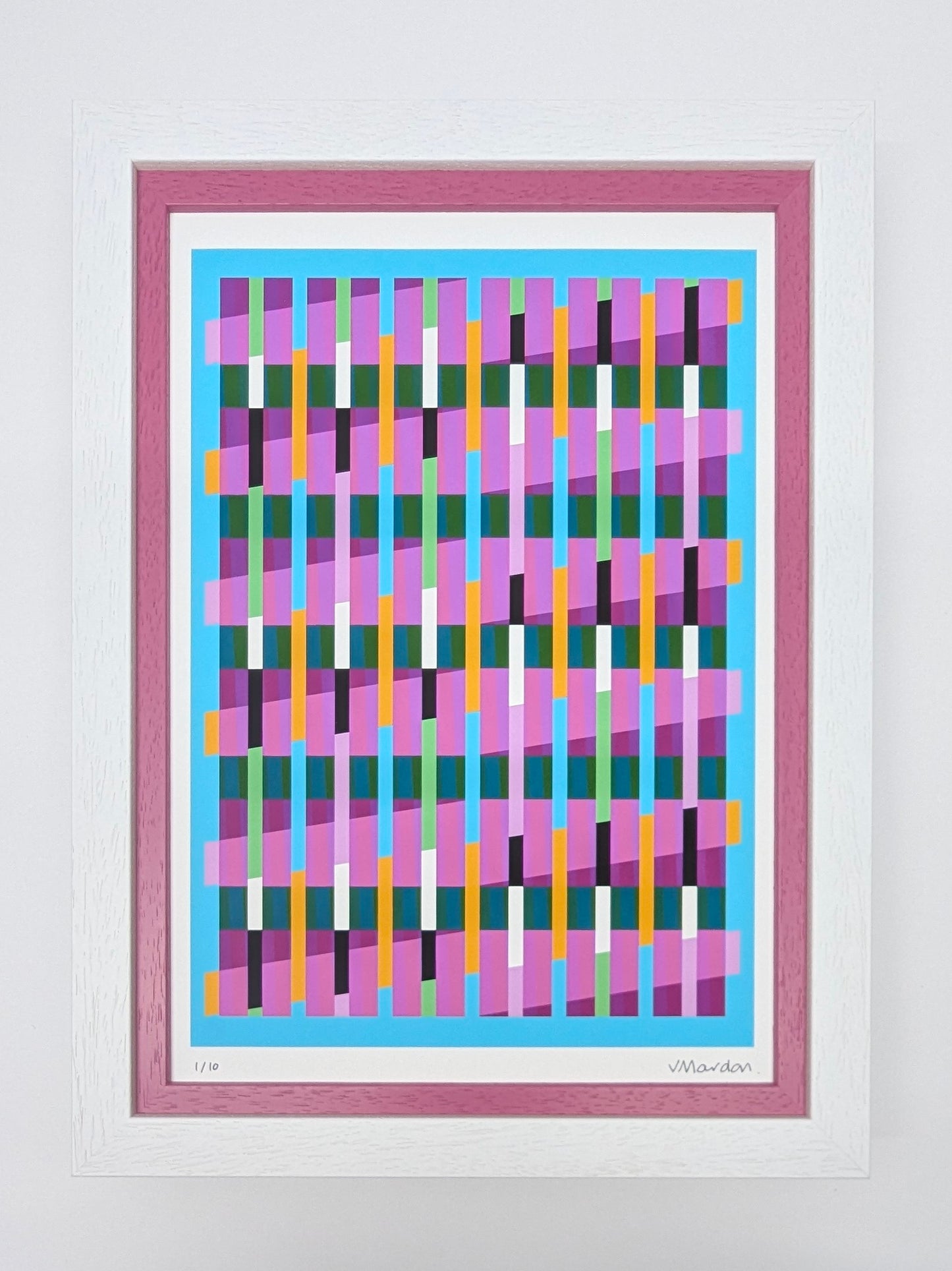 Framed abstract artwork with colorful geometric design on a light gray background