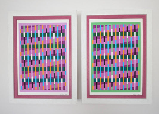 Two abstract art prints with colorful geometric patterns in pink frames on a white background.