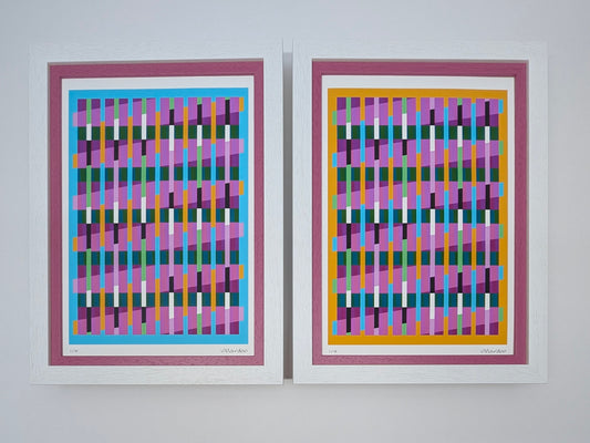 Two abstract art prints with colorful geometric patterns on a white wall.